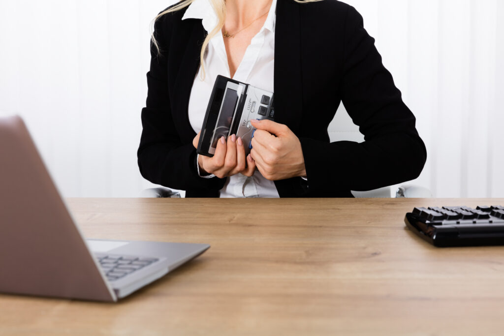 Closeup,of,businesswoman,stealing,a,calculator,from,office,desk